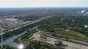 Aerial view of Chernobyl nuclear power plant territory and the fourth power unit of the reactor, covered with a dome. Exclusion Zone. Camera moves back. 4K drone footage