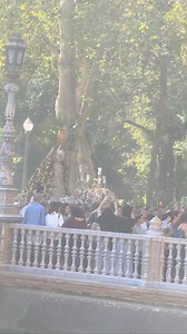 A Daytime Procession to Honour Our Virgin Mary in Seville During the day, Seville’s streets were alive with devotion and colour as a procession honoured the Virgin Mary. Locals and visitors alike partook in the procession, walking alongside the ornate float, while flowers, banners, and the gentle sound of drums and chants filled the air. Watching it unfold, I felt the city’s deep connection to its traditions - a moving glimpse into Seville’s soul. | Journey beyond the chair