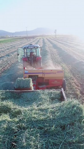 Efficient Hay Baling with a Tractor and Baler