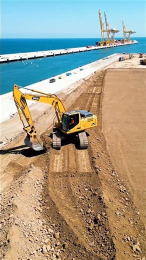 Heavy Equipment at Work: Excavator & Water Truck Dominating the Site! 🚧