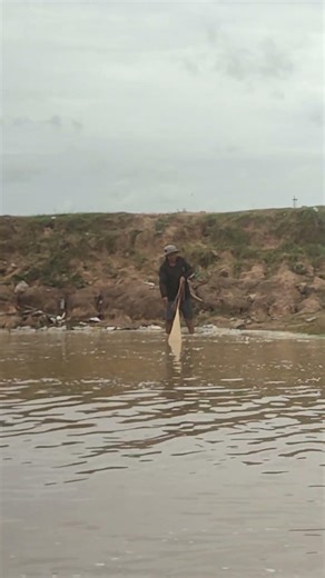 A cast net fishing traditional trap in the village #shorts