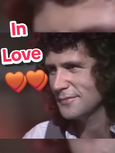 John Illsley's Admiring Gaze at Mark Knopfler