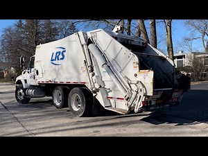 LRS Rear Loader Garbage Trucks Packing Bulk Waste at the Spring Cleanup - Highland Park, Illinois