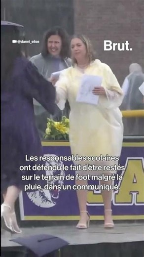 High school students receive their diplomas in a torrential downpour in the United States.