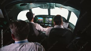 Instructor and pilots in professional flight simulator during flight