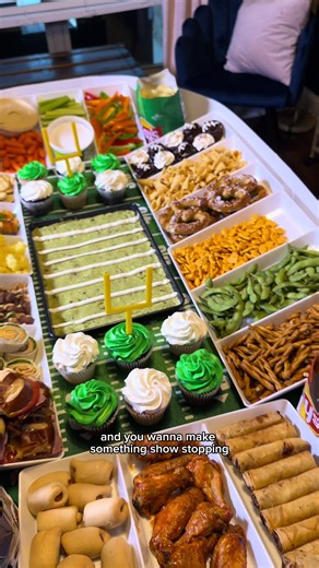 🏟️ DIY Super Bowl Snack Stadium 🏈 Because snacks deserve a stadium moment. Want to recreate this epic Super Bowl snack spread? Here’s how to make your own snack stadium using simple supplies 👇 What you’ll need: • White plastic snack containers or trays- the trays I’m using come in packs of 3, so I used 2 packs. You could also use disposable aluminum trays. • Pool noodles- from dollar tree • White duct tape • Poster board- Walmart or dollar tree • Green tablecloth • Football table runner • All