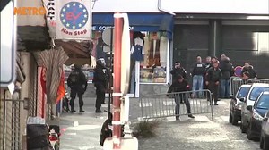 Police remove person on stretcher from scene of Paris shooting
