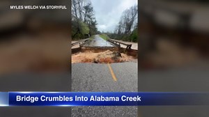 Bridge crumbles into Alabama creek following heavy rain | VIDEO