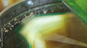 Extraction of honey from honeycombs of nesting frames in a honey extractor. Close-up. Selective sharpness, slow motion. Beekeeping.