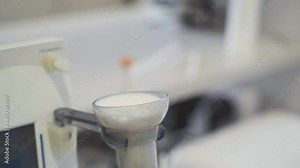 Specialist Taking Sample Of Milk For Thorough Analysis At Microbiology Milk Lab. Lab For Checking Milk Microbiology. Milk Microbiology Modern Research Lab. Food Industry. Dairy Production Technology