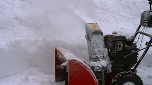Snow blowing machine working - Free Stock Video