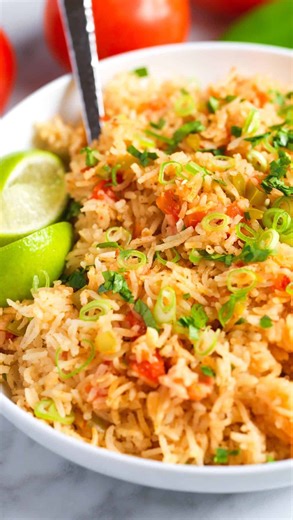 51K views · 804 reactions | The rice recipe I’ve been making on repeat for the last month.⬇️ This rice (inspired by Mexican rice also called Spanish rice) has fresh flavor from onion, LOTS of garlic, Anaheim peppers and fresh tomatoes. It cooks for 14 minutes on low and then sits covered with a lid for 10 so it gets super light and fluffy!  The recipe is linked on our bio. #spanishrice #texmex #rice #sidedish #recipes | Inspired Taste | Facebook