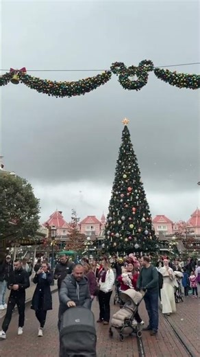 Disneyland Paris Main Street with the magical snow and princess castle #disneylandparis #disneyland