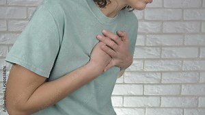 Woman has heart attack. Heart attack. The woman suffers from pain in the heart.