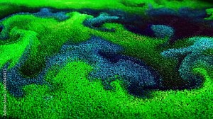 4K Multicolored particles balls spheres abstract flowing substance liquid with gradient. A stream of particles moves across the background as a simulated wave of dots. Surreal motion. 3d animation