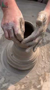 Making a beautiful clay pot on a potter’s wheel