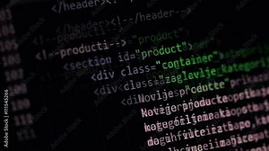 Fixed shallow-focus shot of a computer screen scrolling eCommerce webpage HTML code.