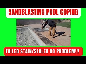 Sandblasting pool coping to remove peeling paint.