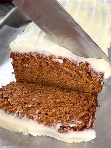 This is the BEST Carrot Cake Loaf Cake you’ll ever make. It’s soft and FULL of carrot cake flavor with a delicious cream cheese frosting! #recipe #baking #dessert #loafcake #carrotcake