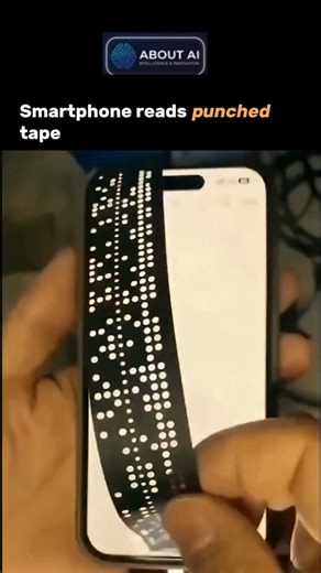 All About AI | News | Trends | Updates | Tools on Instagram: "This is what happens when nostalgia meets innovation. A modern smartphone is being turned into a retro data reader—no bulky machines, no functioning mainframe required. Using just the phone’s camera, a custom app visually scans the perforations on vintage punched tape and instantly translates those hole patterns into binary code. Decades-old data, once locked inside obsolete systems, can now be digitized in seconds. It’s not just abou