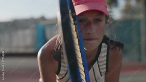 Slow motion portrait of young tennis player