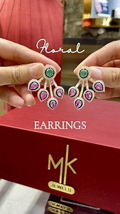Featuring ruby and emerald-coloured stones arranged in a floral pattern, these earrings are the perfect statement piece to elevate any look, whether for day or night. MK JEWELS offers 18kt & 22kt HUID Gold & IGI Certified Real Diamond & Labgrown Diamond Jewellery. STORES 1,2 A N Chambers, Turner Road, Bandra, Mumbai 8 Sneha, Lokhandwala Market, Andheri (W) Mumbai 20 Patwa Chawl, BLG NO 80, Opp Mumbadevi Temple, Zaveri Bazaar, Mumbai - 02 4,5 Surbhi Complex, C G Road, Ahmedabad 6 Stellar, Sindhu 