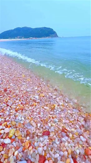 The World’s Most Colorful Beach! Is This Real? 🌈🌊Nature #BeachVibes #HiddenParadise #PebbleBeach