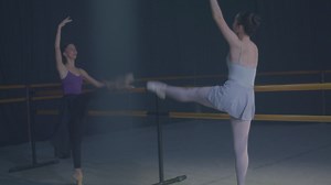 Two ballet dancers practicing at the bars - Free Stock Video