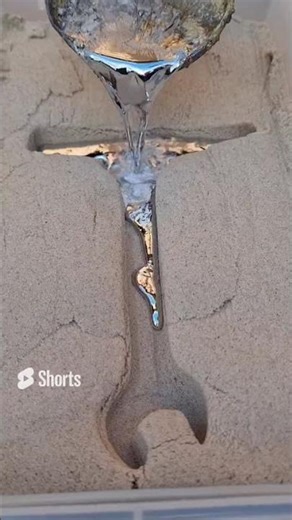 casting aluminum into a sand mold