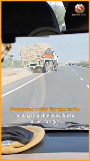 Traffic on a busy Rajasthan national highway was disrupted after a heavy trailer overturned near Pali district, reportedly because the driver fell asleep at the wheel. The incident, which occurred in the early hours, caused multiple lanes to be blocked, leaving commuters and goods carriers stranded for over an hour. The driver sustained minor injuries and was taken for medical examination. Authorities deployed cranes to remove the trailer and managed traffic until the road was cleared. Police ar