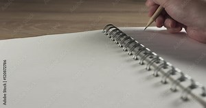 teen girl hand writes gift list on notepad