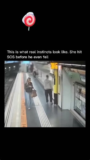 viku on Instagram: "The video is CCTV footage from a Barcelona metro station (Plaza de España, Line 3), showing a quick-thinking off-duty Mossos d'Esquadra police officer named Felisa Pozas saving a disoriented man who falls onto the tracks. Here's a step-by-step breakdown of what happens: The scene opens on a subway platform with a few passengers waiting. A woman (Pozas) is walking along the platform edge, looking at her phone, while a man in a light hoodie appears unsteady on his feet, stumbli