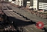 November 24, 1963 – Washington DC USA: Spectators watch as the funeral procession of President John F. Kennedy moves ahead towards the U.S. Capitol.