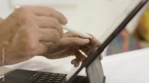 Close up person using Apple Pencil to create digital artwork on iPad