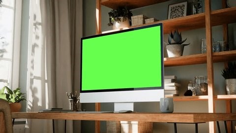 clip-4015075281-computer-monitor-green-screen-mockup-angled-view