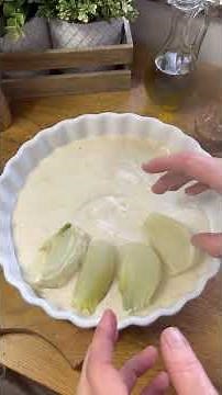 Fennel au gratin with béchamel sauce and sausage.