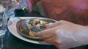 Professional video of eating snails in restaurant in 4K Slow motion 60fps