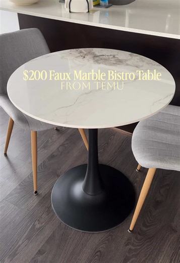 $200 faux marble bistro table from TEMU! I fell in love with this table on Wayfair and discovered the exact same one on Temu for over $100 less! They even used some of the same pictures 😂 I took the gamble and it actually looks stunning. The shiny sintered stone gives a truly realistic marble finish and 30” diameter is the perfect table for 2! It came in 3 days and was easy to assemble. Obsessed!😍 @Temu #kitchendesign #kitchentable #smallkitchen
