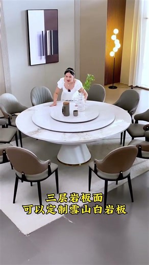 features a modern light luxury style extendable round dining table with a rotating center.