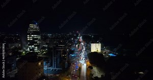 Limassol After Dark: Aerial Revelations of Cyprus Metropolis, Showcasing Gleaming High-Rise Structures and Nighttime Traffic. High quality 4k footage