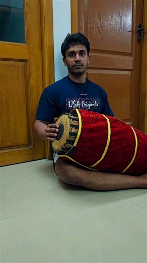 Giridharan Prem on Instagram: "The mridangam is an ancient, double-sided barrel drum that is the primary rhythmic accompaniment instrument in South Indian (Carnatic) classical music. It is highly revered, often called the "king of percussion instruments" in the region and depicted in ancient texts and sculptures as a divine instrument. #mridhangam #mridhangavidhwan #percussioninstruments #percussionist"