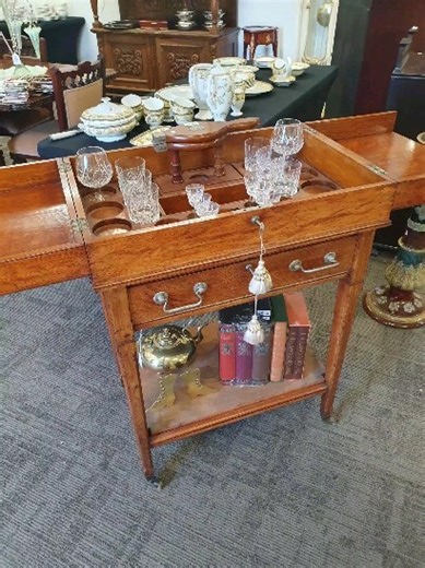 This solid wood cocktail trolley comes with glasses, storage, ice section, citrus juicer. It is truly an excellent collectable item for the beverage connoisseur!! Public viewing is open Thursday Saturday before the auction closes in our Walcott St showrooms. Lots online 20 October #cocktails #antiquetrolley #collectable #spirits #cocktailserver #collectables #rarefinds #antiques #antiqueserver #teatrolley #beveragecollection #collectors #auctionsonline #onlineauctions | Donelly Auctions - Qualit