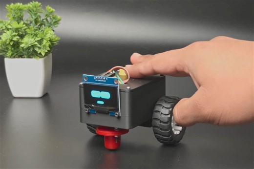 This adorable ESP32 desk robot won't stop bothering you until you pet it
