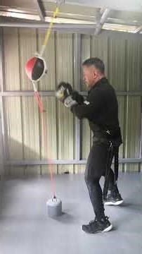 Crazy senior doing boxing workout with added arms and legs tension bands.