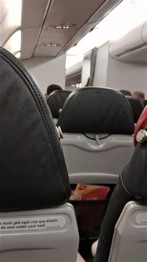 Flight attendant shows how to use tools on plane