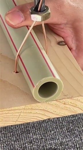 fastening a pipe using wire using a nut that is turned using wire#youtubeshorts