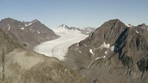 Harding Icefield Alaska Icefield glacier with snow and ice melting cause of global warming pollution, aerial view of Kenai mountains