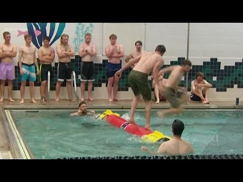 Lumberjack log-rolling competition takes over swimming pool
