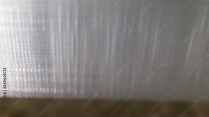 Mesh inside the printed 3D model, frame, ribs extremely close-up. Triangular mesh transparent plastic PETG glitters and shimmers. Real time, the object moves vertically, the outer wall of the product