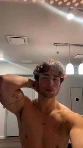 Muscular Male Flexing in Modern Minimalist Room